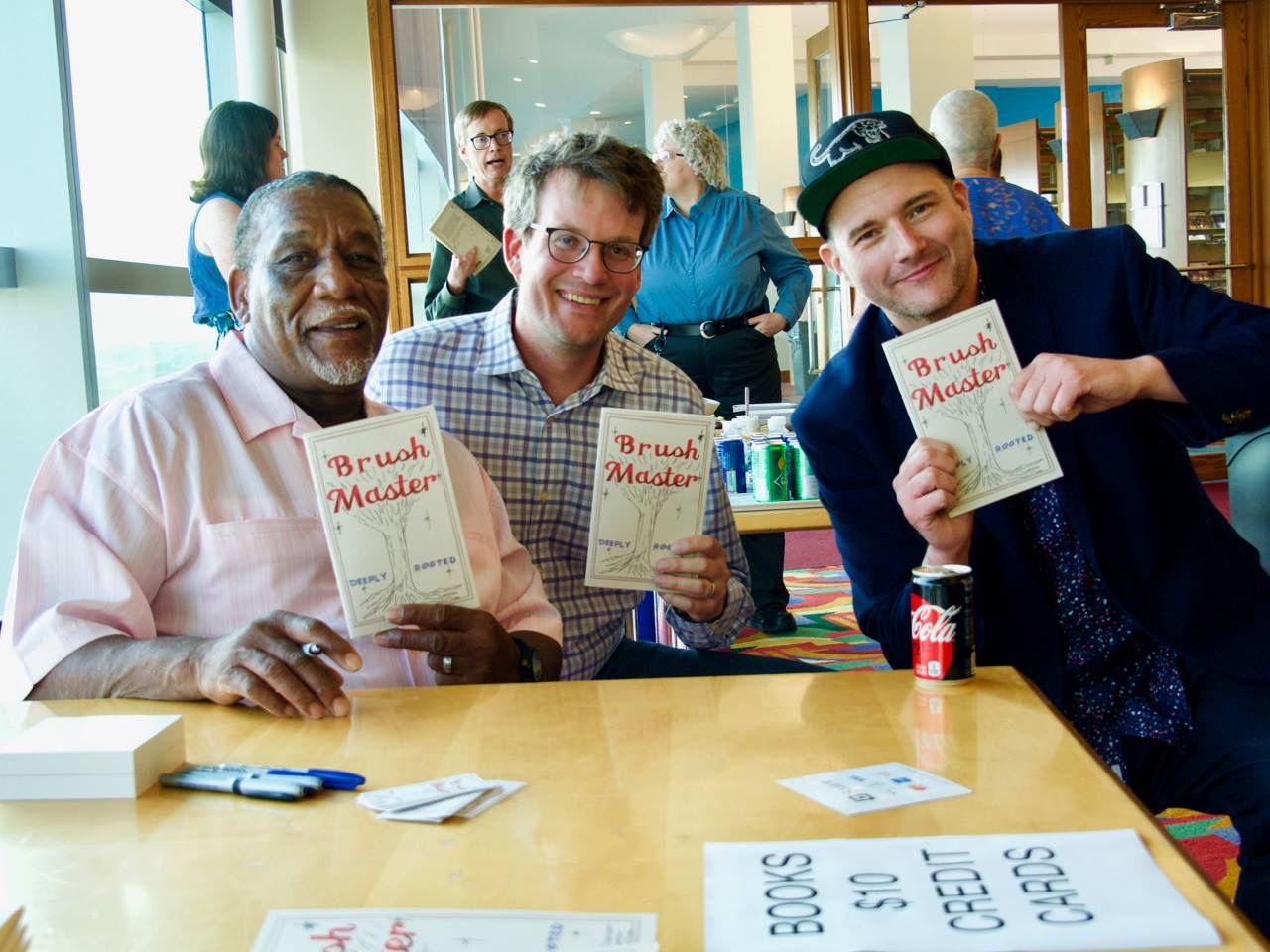L to R: the Brush Master (aka Jasper Travis), John Green, and Kyle Long at Central Library book release party